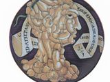 a plate with a picture of a man holding a bunch of nuts