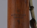 a close up of a wooden object with a metal handle