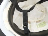 a close up of a white helmet with a black strap