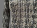 an image of a woman ' s dress made of pleated fabric