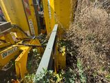 a yellow machine that is sitting on the side of the road