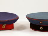 two hats sitting next to each other on a table