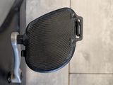 a close up of a motorcycle mirror on the side of the road