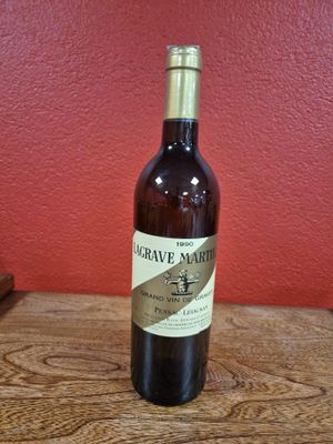 a bottle of wine that is sitting on a table