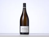 a close up of a bottle of wine on a table