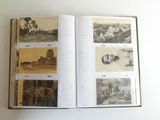 an open book with pictures of people and buildings on it