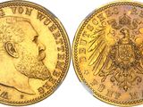 a gold coin with an image of a man and a eagle on it