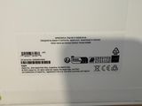 the back of a white box with a picture of a person standing next to it