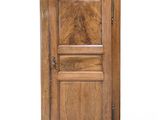 an old wooden cabinet with a door on the top
