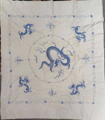 an image of a blue and white table cloth with a dragon on it