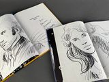 two pages of a drawing book with a drawing of a man and a woman