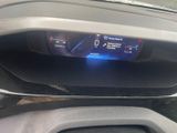 the dashboard of a car with a digital display in the center