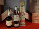 several bottles of wine are sitting on a table next to a box
