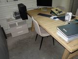 a desk with a computer and a laptop on it