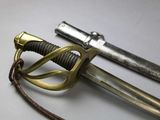a close up of a pair of swords on a table