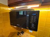 a microwave that is sitting on a counter in a kitchen