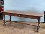 a wooden table with a drawer underneath it on a hard wood floor