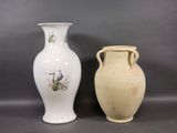 two vases sitting next to each other on a table
