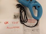 a blue electric glue gun sitting on top of a white table