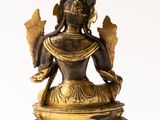 an image of a statue of a person sitting in a lotus position