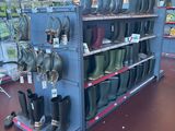 many pairs of rain boots on the shelves in the store