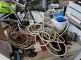 a pile of electrical equipment on a table in a room