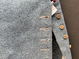 a close up of a pair of pants with buttons on them