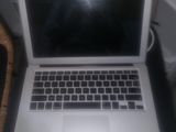 a laptop computer that is sitting on a table