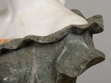 marble bust of a woman wearing a dress with a frillying collar