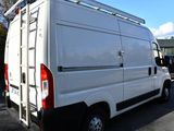 a white van that is parked in a parking lot