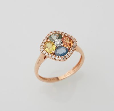 a yellow gold ring with multi colored stones and diamonds