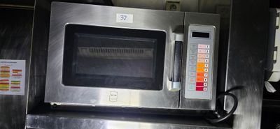 an image of a stainless steel microwave oven in a kitchen