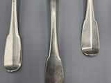 five spoons and two spoons that are on a table