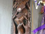 two figurines that are on display on a table