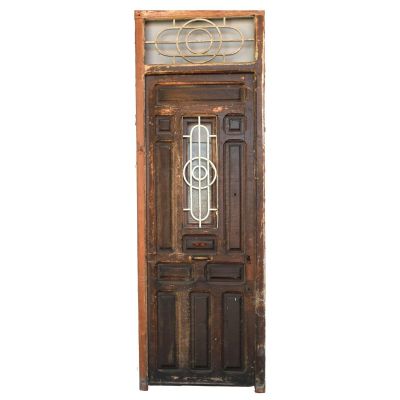 an old door with a glass window on it