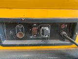 a close up of a yellow truck ' s electrical panel