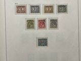 an open book with a picture of a number of stamps on it