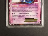 a close up of a pokemon card in a plastic container