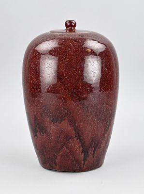 a red apple that is sitting on a white surface