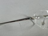 a close up of a pair of glasses on a table