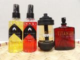 three different types of colognes sitting on a wicker mat