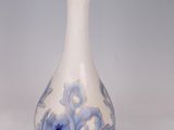 an image of a blue and white vase on a white background