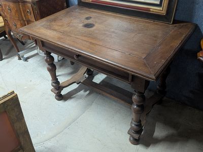 a wooden table with a mirror on top of it