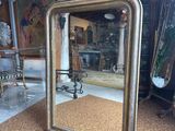 a mirror that is sitting on the floor in a room