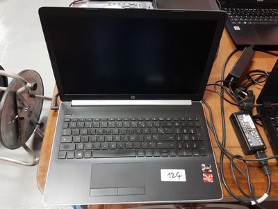 a laptop computer that is sitting on a desk