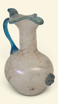 a white vase with a blue handle on a white background
