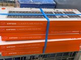 several boxes of laptops stacked on top of each other in a store