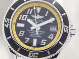 a close up of a wrist watch with a black and yellow face