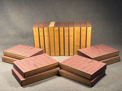several books are stacked on top of each other on a table