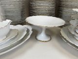 a lot of plates and cups on the table